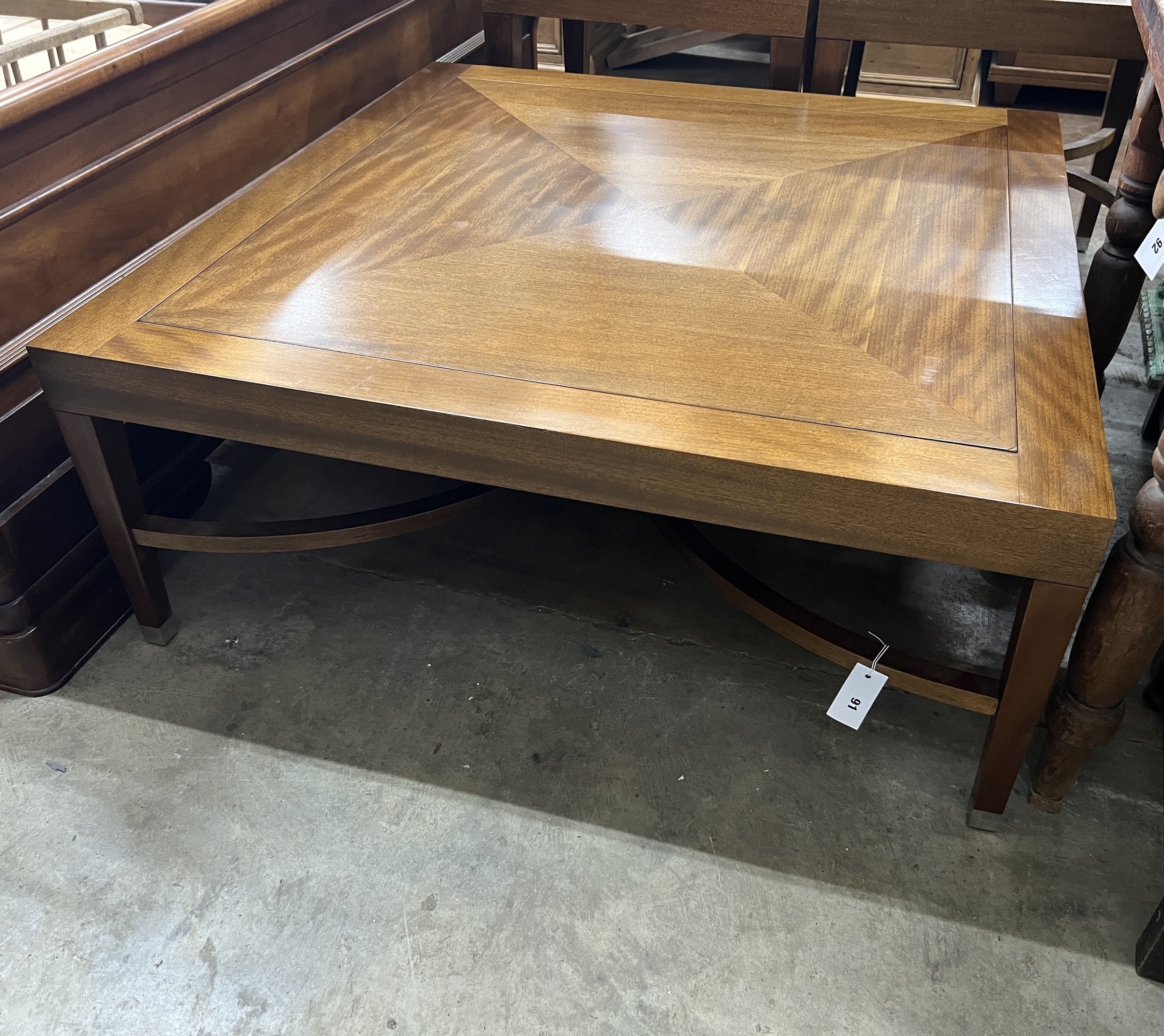 A contemporary South African mahogany square coffee table, width 110cm, height 45cm